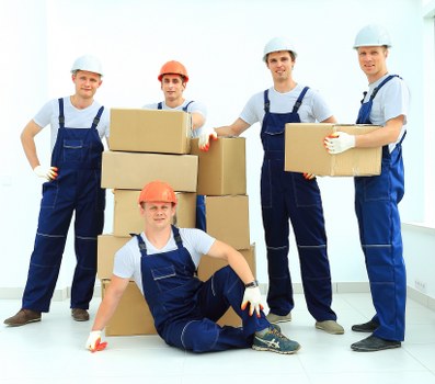 Professional movers handling furniture in Wimbledon