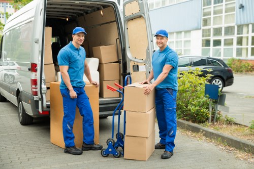 Staff organizing packing and labeling for an office move